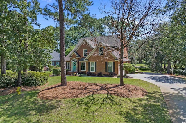 3975 River Hills Dr, Little River, SC 29566 - view of front of home featuring driveway and a front yard