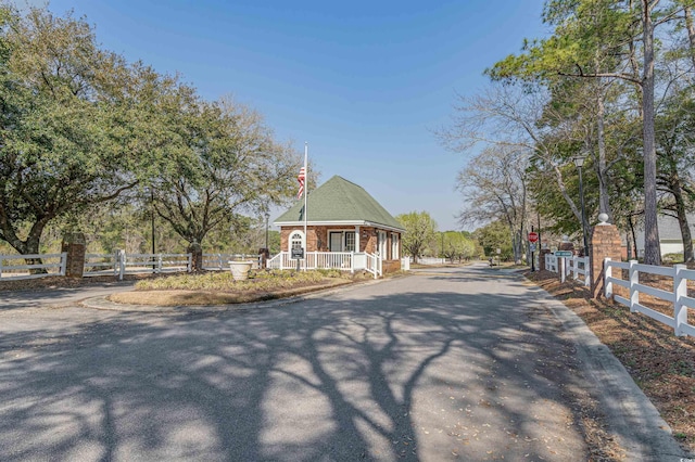 3975 River Hills Dr, Little River, SC 29566 - view of asphalt street with traffic signs and curbs