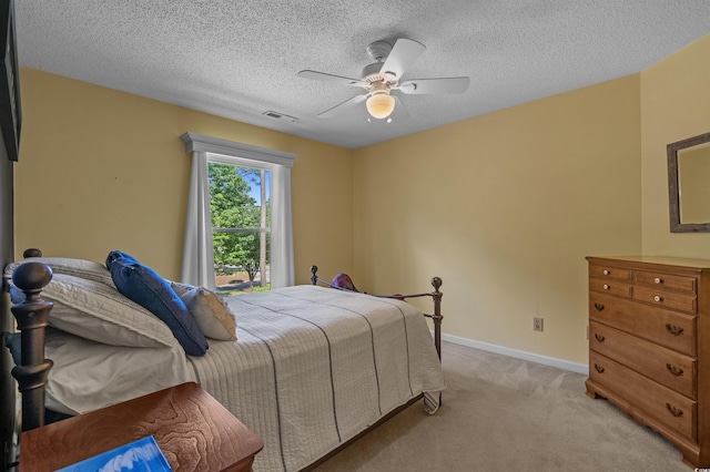 3975 River Hills Dr, Little River, SC 29566 - bedroom featuring light carpet, ceiling fan, and a textured ceiling
