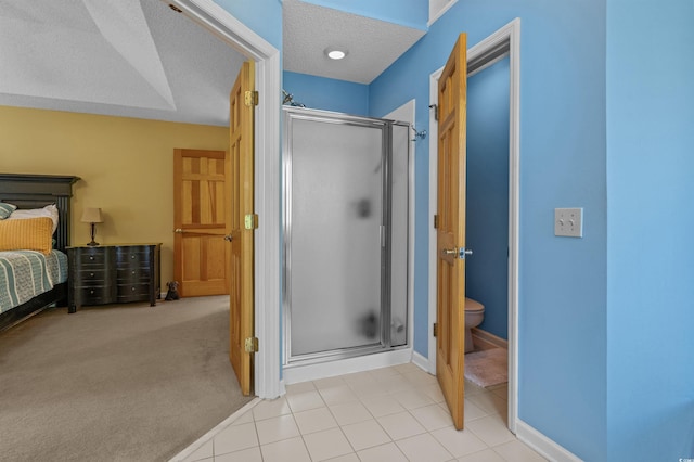3975 River Hills Dr, Little River, SC 29566 - bathroom with a stall shower, a textured ceiling, and tile patterned floors