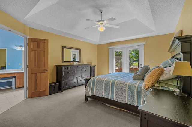 3975 River Hills Dr, Little River, SC 29566 - bedroom featuring access to outside, a textured ceiling, a raised ceiling, light carpet, and a ceiling fan