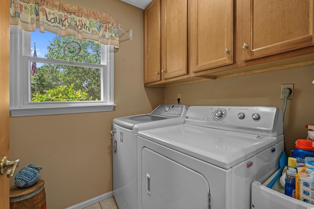 3975 River Hills Dr, Little River, SC 29566 - laundry room featuring washer and dryer, cabinet space, healthy amount of natural light, and light tile patterned floors