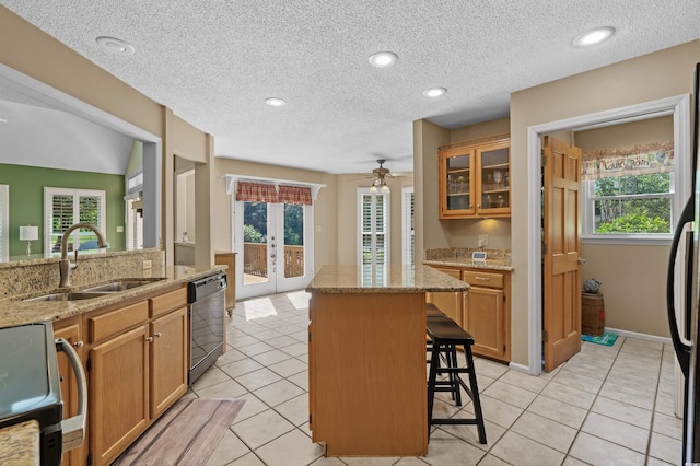 3975 River Hills Dr, Little River, SC 29566 - kitchen featuring dishwashing machine, french doors, range with electric stovetop, a kitchen breakfast bar, and a kitchen island