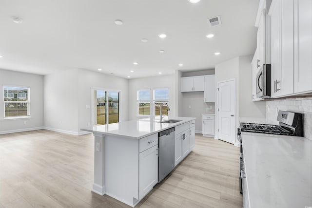 4881 Hopespring St, Myrtle Beach, SC 29579 - kitchen with stainless steel appliances, light wood finished floors, healthy amount of natural light, and recessed lighting