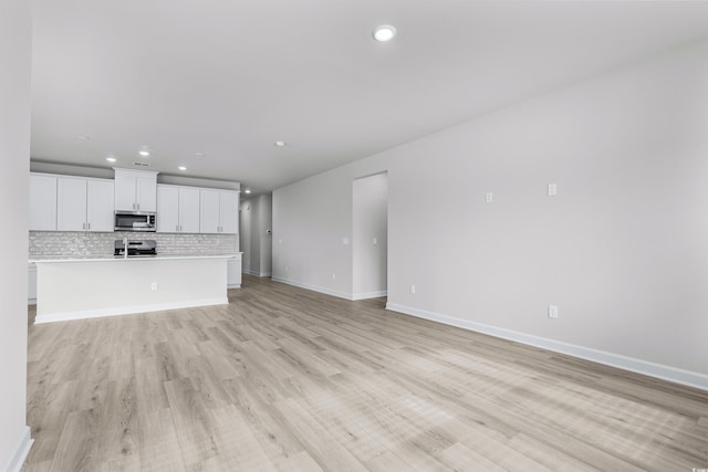 4881 Hopespring St, Myrtle Beach, SC 29579 - unfurnished living room with recessed lighting and light wood finished floors