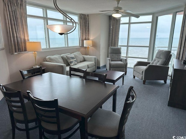 3601 N Ocean Blvd Unit 1139, North Myrtle Beach, SC 29582 - dining space featuring a ceiling fan, a water view, and carpet floors
