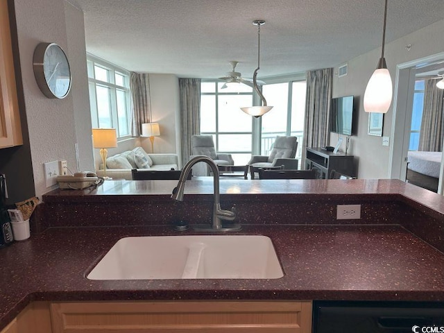 3601 N Ocean Blvd Unit 1139, North Myrtle Beach, SC 29582 - kitchen with open floor plan, a textured ceiling, ceiling fan, dark stone countertops, and decorative light fixtures