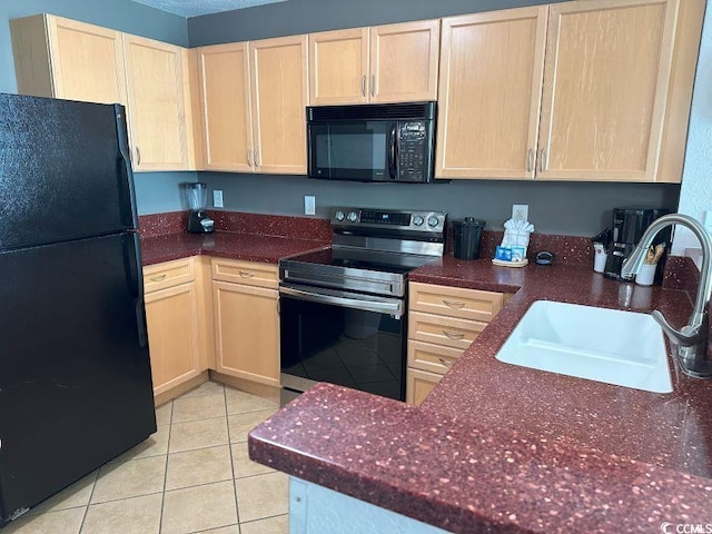 3601 N Ocean Blvd Unit 1139, North Myrtle Beach, SC 29582 - kitchen with black appliances, light brown cabinetry, and light tile patterned floors