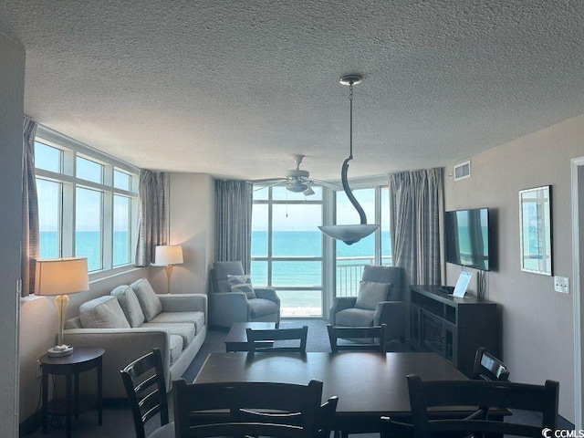 3601 N Ocean Blvd Unit 1139, North Myrtle Beach, SC 29582 - living room with a textured ceiling and a ceiling fan