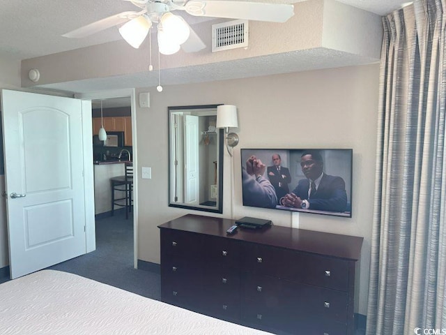 3601 N Ocean Blvd Unit 1139, North Myrtle Beach, SC 29582 - unfurnished bedroom with dark colored carpet and ceiling fan