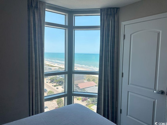 3601 N Ocean Blvd Unit 1139, North Myrtle Beach, SC 29582 - bedroom with multiple windows and a water view