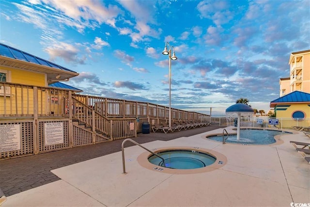 3601 N Ocean Blvd Unit 1139, North Myrtle Beach, SC 29582 - community pool featuring a community hot tub, a patio area, stairs, and a deck