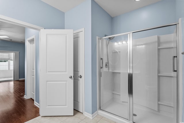 156 Parmelee Dr Unit D, Murrells Inlet, SC 29576 - bathroom with a stall shower, ceiling fan, and wood finished floors