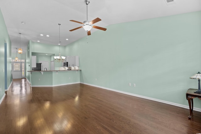 156 Parmelee Dr Unit D, Murrells Inlet, SC 29576 - unfurnished living room featuring a chandelier, dark wood-style floors, a ceiling fan, recessed lighting, and high vaulted ceiling