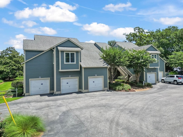 824 Castleford Cir Unit 7C, Myrtle Beach, SC 29572 - view of front of house with a shingled roof and an attached garage