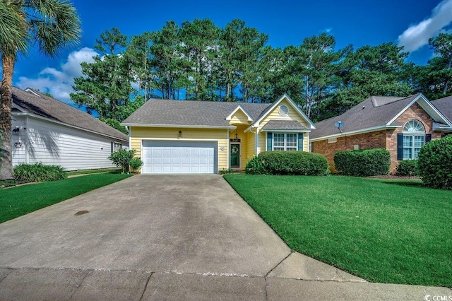 2602 Clearwater St, Myrtle Beach, SC 29579 - view of front facade featuring a front yard, an attached garage, and driveway