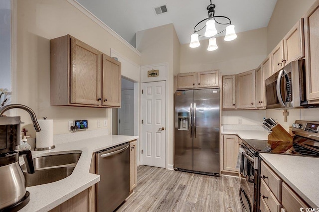 2602 Clearwater St, Myrtle Beach, SC 29579 - kitchen featuring stainless steel appliances, light wood finished floors, a chandelier, decorative light fixtures, and light brown cabinets