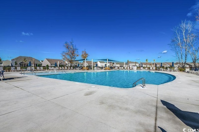 100 Culpepper Way Unit 1002, Myrtle Beach, SC 29579 - community pool featuring a patio and a residential view