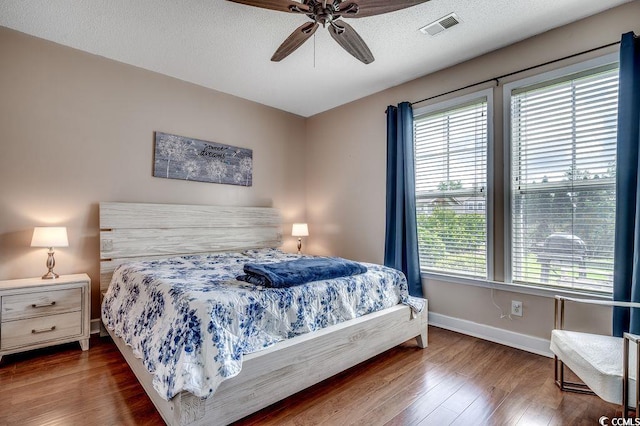 100 Culpepper Way Unit 1002, Myrtle Beach, SC 29579 - bedroom with multiple windows, wood finished floors, and ceiling fan