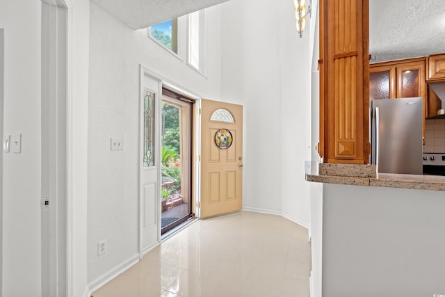 310 74th Ave N Unit 7, Myrtle Beach, SC 29572 - foyer entrance featuring baseboards and a textured ceiling