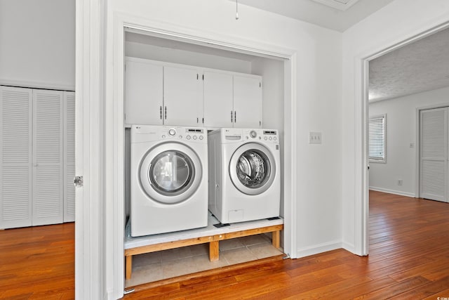 310 74th Ave N Unit 7, Myrtle Beach, SC 29572 - washroom with washer and dryer and hardwood / wood-style floors