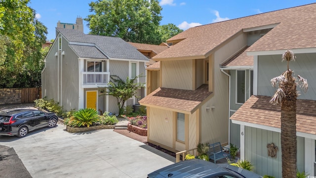 310 74th Ave N Unit 7, Myrtle Beach, SC 29572 - view of front facade featuring a shingled roof and a chimney