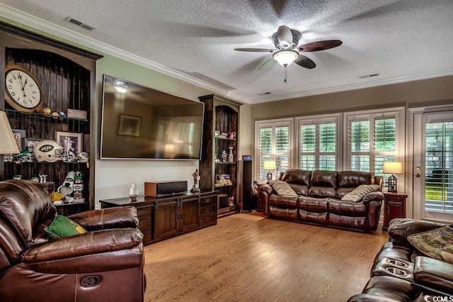 2450 Marsh Glen Dr Unit 112, North Myrtle Beach, SC 29582 - living area with a ceiling fan, a textured ceiling, light wood finished floors, and ornamental molding