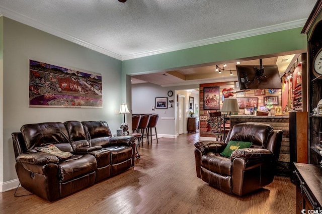 2450 Marsh Glen Dr Unit 112, North Myrtle Beach, SC 29582 - living area with wood finished floors, crown molding, a textured ceiling, and a dry bar