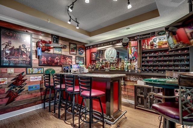 2450 Marsh Glen Dr Unit 112, North Myrtle Beach, SC 29582 - indoor dry bar with a textured ceiling, wood finished floors, and track lighting