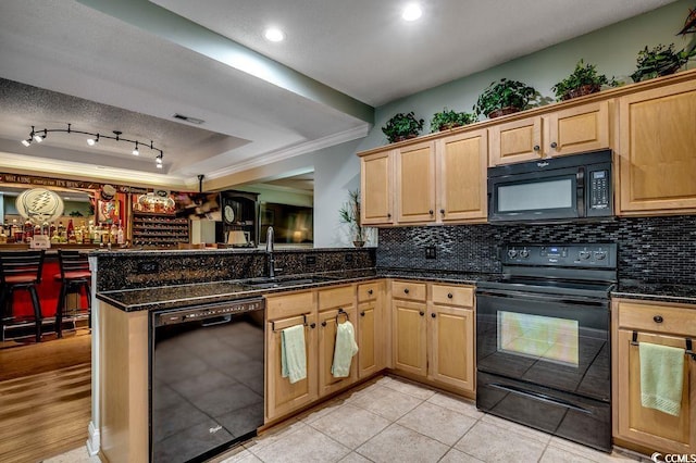 2450 Marsh Glen Dr Unit 112, North Myrtle Beach, SC 29582 - kitchen featuring black appliances, crown molding, backsplash, dark stone countertops, and recessed lighting