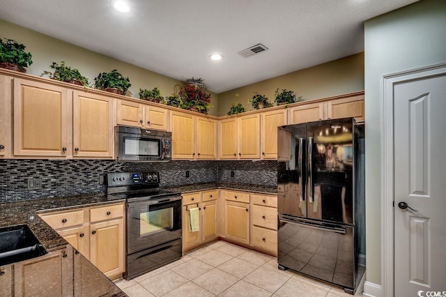 2450 Marsh Glen Dr Unit 112, North Myrtle Beach, SC 29582 - kitchen with black appliances, backsplash, light brown cabinets, dark stone countertops, and recessed lighting