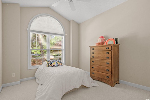 907 Tidewater Dr, North Myrtle Beach, SC 29582 - bedroom with carpet floors, vaulted ceiling, and a ceiling fan