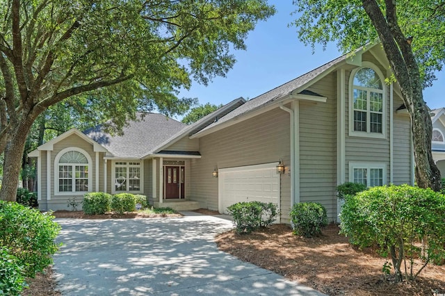 907 Tidewater Dr, North Myrtle Beach, SC 29582 - traditional-style house with concrete driveway, an attached garage, and a shingled roof