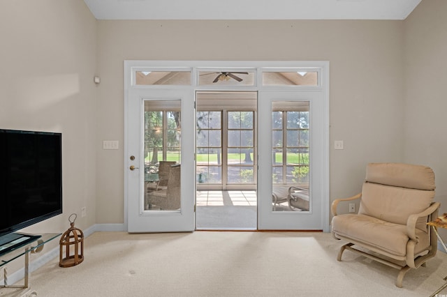 907 Tidewater Dr, North Myrtle Beach, SC 29582 - doorway to outside with carpet flooring and a ceiling fan