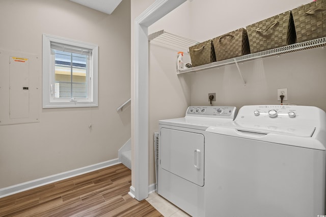 907 Tidewater Dr, North Myrtle Beach, SC 29582 - washroom featuring electric panel, washer and clothes dryer, and light wood-type flooring