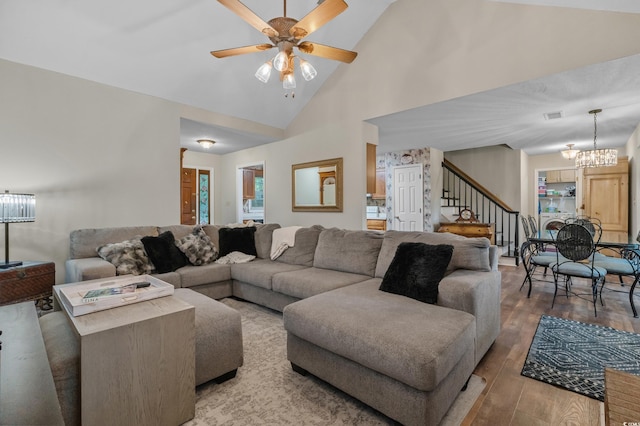 311 Ashwood Ln, Myrtle Beach, SC 29588 - living room with wood finished floors, a chandelier, a ceiling fan, stairs, and high vaulted ceiling