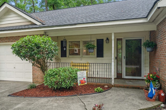 311 Ashwood Ln, Myrtle Beach, SC 29588 - entrance to property featuring covered porch, roof with shingles, brick siding, and an attached garage