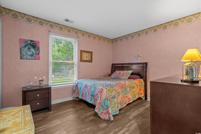 311 Ashwood Ln, Myrtle Beach, SC 29588 - bedroom with baseboards and wood finished floors