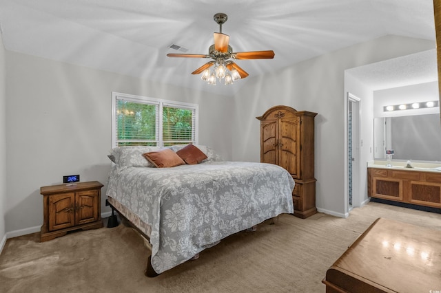 311 Ashwood Ln, Myrtle Beach, SC 29588 - bedroom with light colored carpet, a ceiling fan, lofted ceiling, and ensuite bath