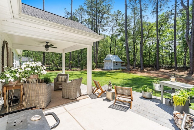 589 Boundaryline Dr NW, Calabash, NC 28467 - view of patio featuring ceiling fan and an outbuilding