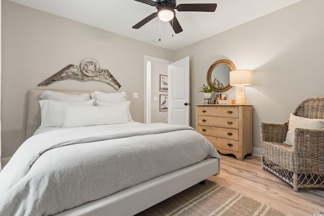 589 Boundaryline Dr NW, Calabash, NC 28467 - bedroom with light wood-style floors and a ceiling fan