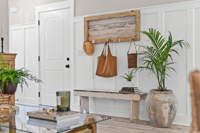 589 Boundaryline Dr NW, Calabash, NC 28467 - interior space with a decorative wall, wainscoting, and wood finished floors