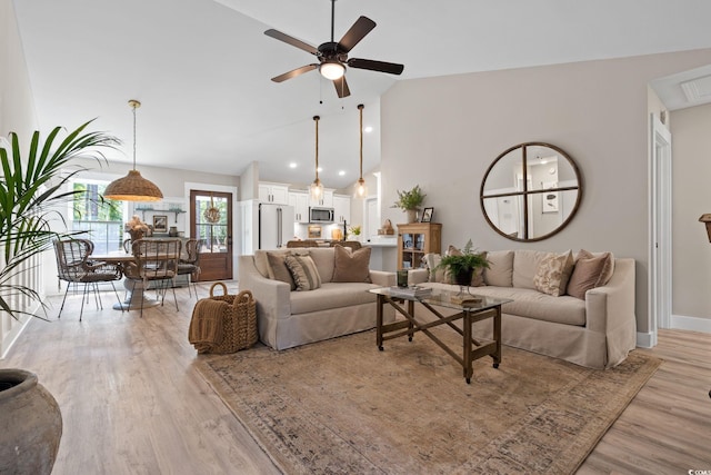 589 Boundaryline Dr NW, Calabash, NC 28467 - living room with light wood-style floors, ceiling fan, and high vaulted ceiling