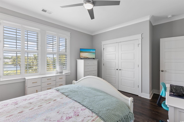 966 Crystal Water Way, Myrtle Beach, SC 29579 - bedroom featuring dark wood finished floors, a closet, crown molding, and a ceiling fan