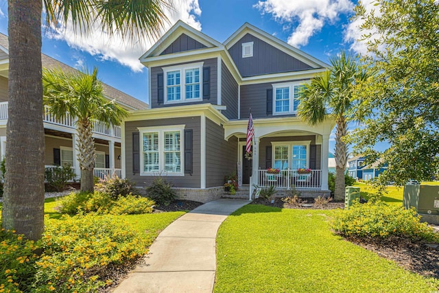966 Crystal Water Way, Myrtle Beach, SC 29579 - view of front facade featuring a porch, a front yard, and board and batten siding