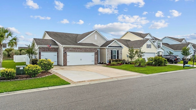 138 Copper Leaf Dr, Myrtle Beach, SC 29588 - view of front of house featuring a garage, a front yard, brick siding, and driveway