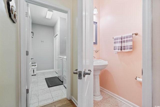138 Copper Leaf Dr, Myrtle Beach, SC 29588 - bathroom with washing machine and clothes dryer and tile patterned floors