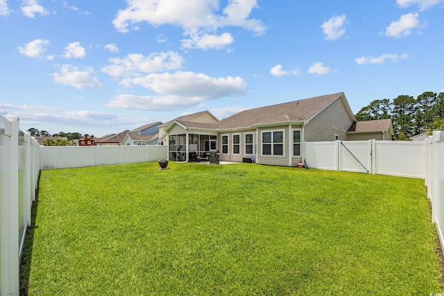 138 Copper Leaf Dr, Myrtle Beach, SC 29588 - rear view of property featuring a fenced backyard, a shingled roof, and a sunroom