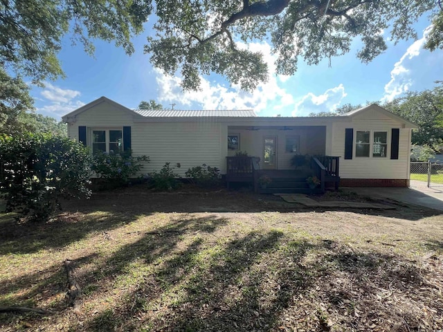 518 Nowell St, Georgetown, SC 29440 - rear view of property featuring a porch and a metal roof
