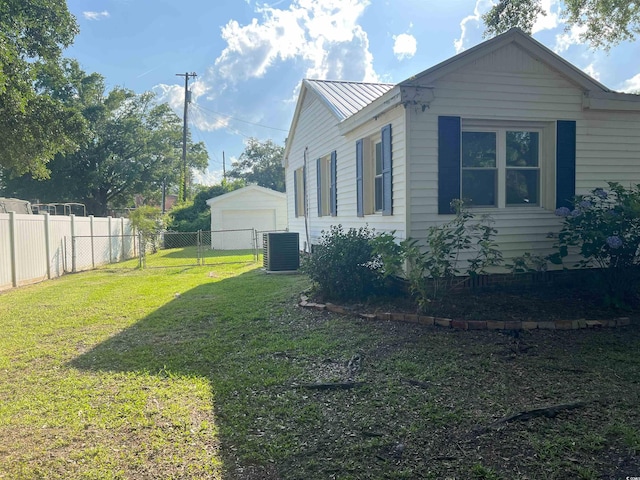 518 Nowell St, Georgetown, SC 29440 - view of property exterior with a garage, a metal roof, and a standing seam roof